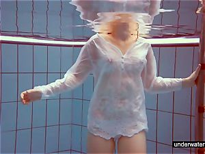 ultra-cute red-haired plays bare underwater