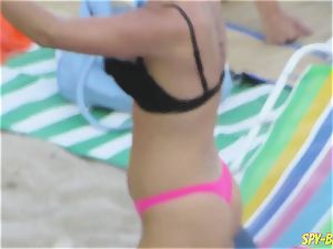 pinkish bikini inexperienced braless hidden cam Beach ladies